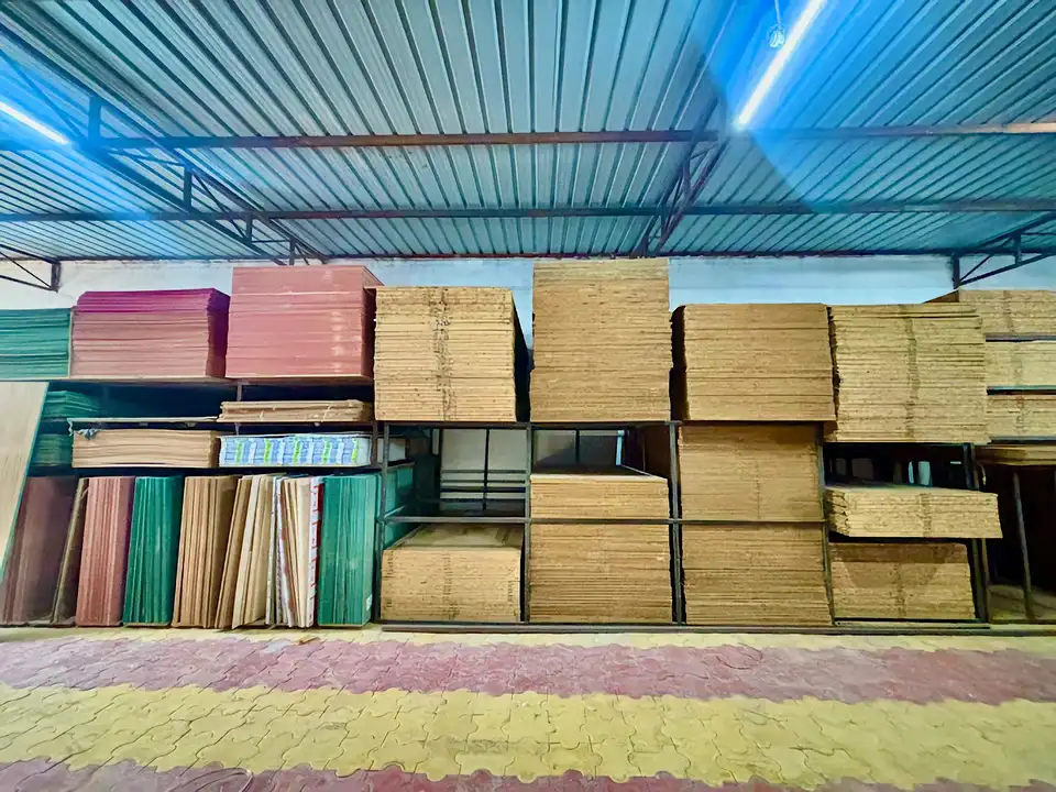 Wide warehouse inventory of coloured and natural boards on industrial shelving