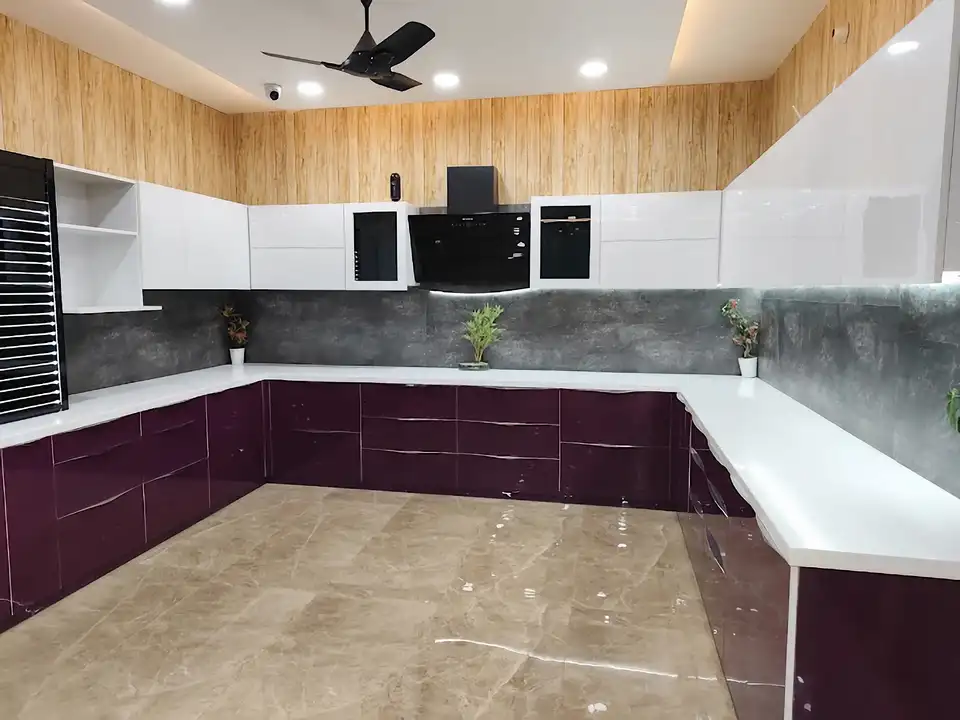 Purple gloss modular kitchen display with hob, chimney hood and tall pantry unit