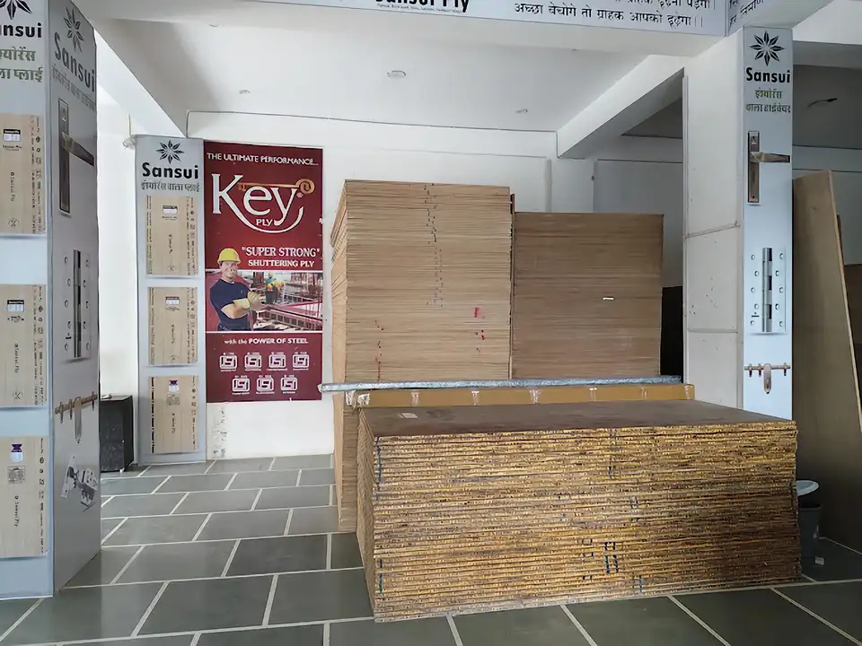 Key Ply shuttering plywood poster with Sansui and standard plywood stacks in the stockroom