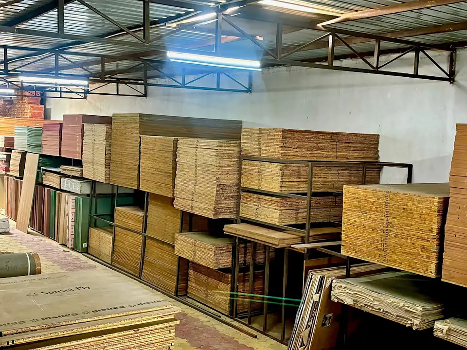 Warehouse aisle with Sunsai IS:303 BWP plywood and board stacks on industrial racks