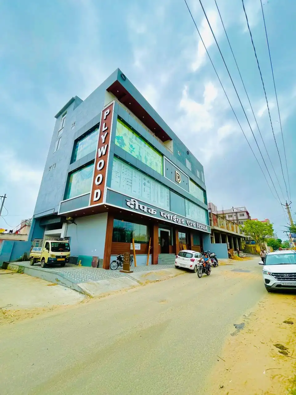 Deepak Plywood and Timbers showroom building seen from the street corner
