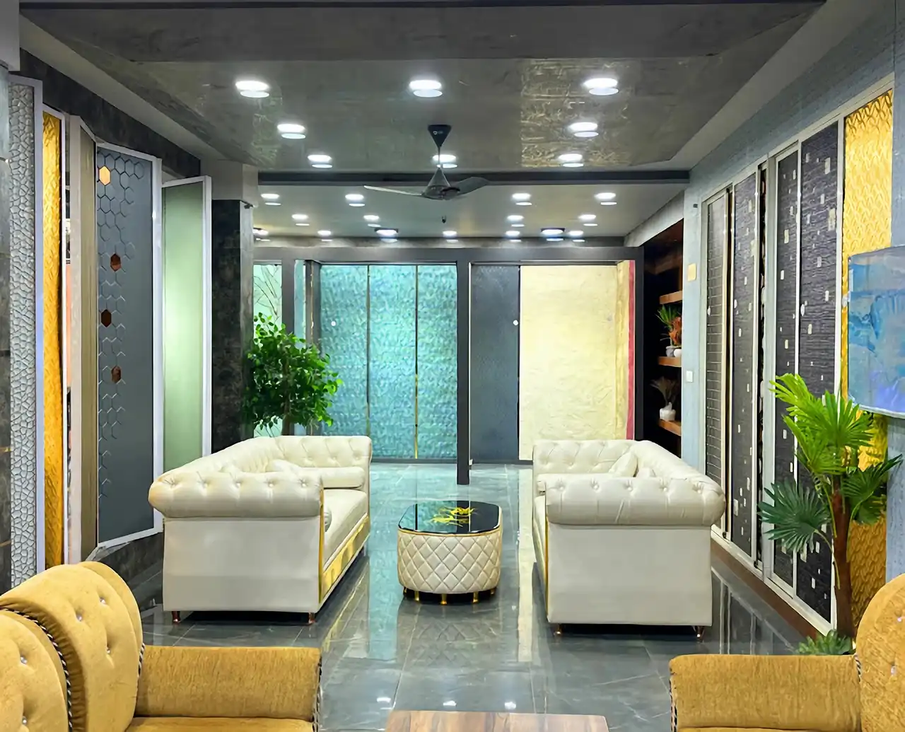 Showroom lounge with Chesterfield seating and decorative wall panels