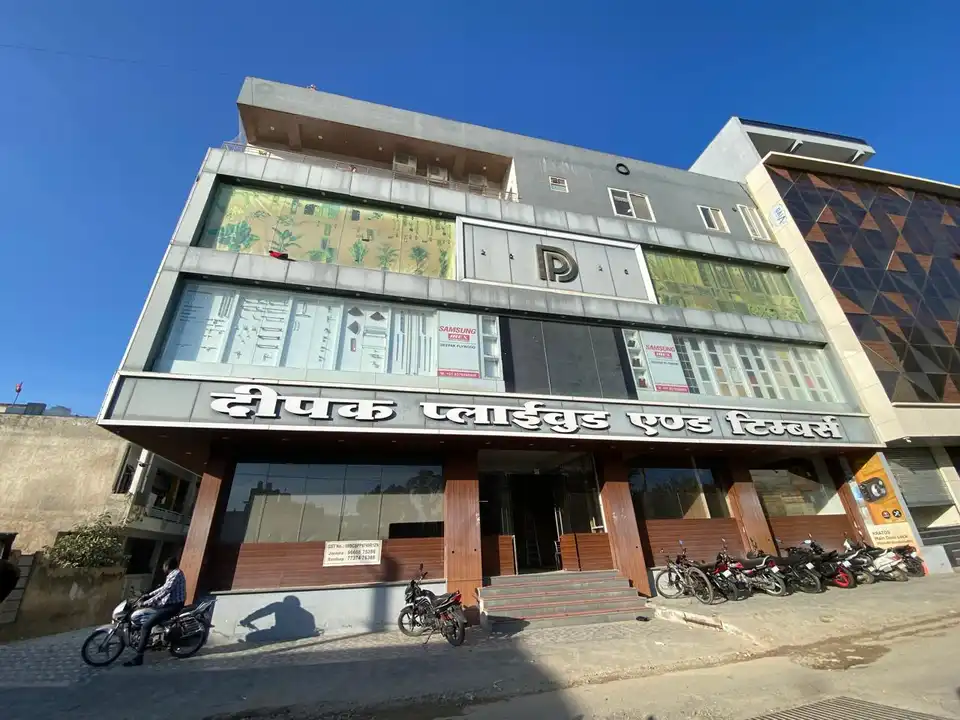 Deepak Plywood and Timbers showroom building with its signboard and glass frontage